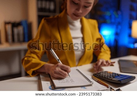 Asian businesswoman working at the office Preparing a report, calculating balance, auditing document, planning, analysis, financial report, investment, business plan, financial analysis concept.