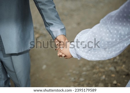 Couple of married holding hands