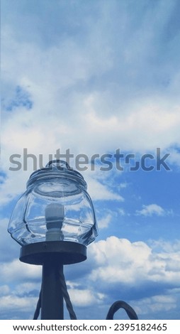 a very beautiful combination ,a view of lamp and blue clouds, 