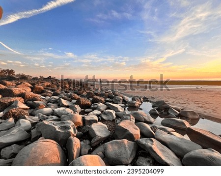 This picture is so beautiful and colourful in sea beach it’s amazing blue sky with white clouds and colourful  stone . I think it’s a beautiful background picture. Beautiful cover photo . Photography