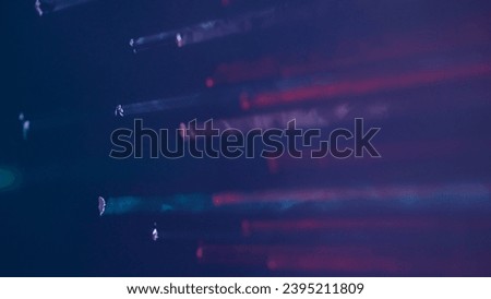 In the shot on a purple, dark background bright light that breaks through the smoke, clouded background. Represents an abstract screensaver or a picture, a patern for something