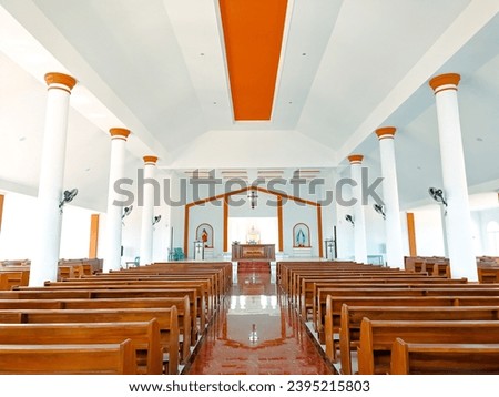 Catholic church interior, seating for Catholic worshipers, Catholic church altar Royalty-Free Stock Photo #2395215803
