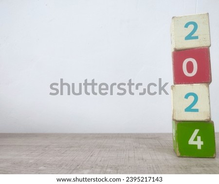Colorful wooden blocks with number 2024, new year concept.