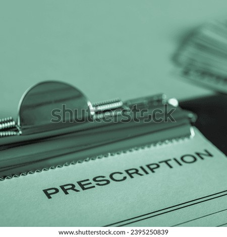 Cost of health care treatment with dollar banknotes and prescription form in monochrome with green tinting