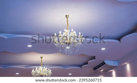 Picture of chandeliers Hanging from the ceiling of the banquet hall were two lanterns, which were especially beautiful when lit. It has a row of small, circular light bulbs. To help increase brightnes