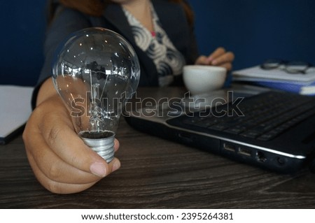 Hand hold light bulb for good idea.