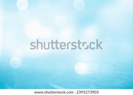 BLUE WINTER BACKGROUND WITH WHITE SPARKLING BOKEH LIGHTS AND BLUE ICE AT THE FOREGROUND, CHRISTMAS AND WINTER BACKDROP FOR WINTER SPORTS, CHRISTMAS PATTERN