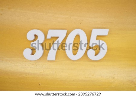 The golden yellow painted wood panel for the background, number 3705, is made from white painted wood.