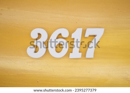 The golden yellow painted wood panel for the background, number 3617, is made from white painted wood.