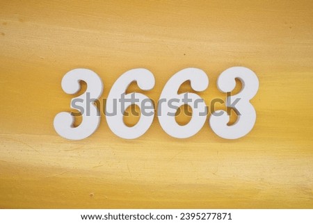The golden yellow painted wood panel for the background, number 3663, is made from white painted wood.