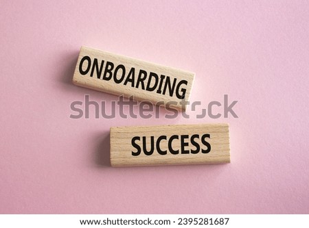 Onboarding Success symbol. Concept word Onboarding Success on wooden blocks. Beautiful pink background. Business and Onboarding Success concept. Copy space