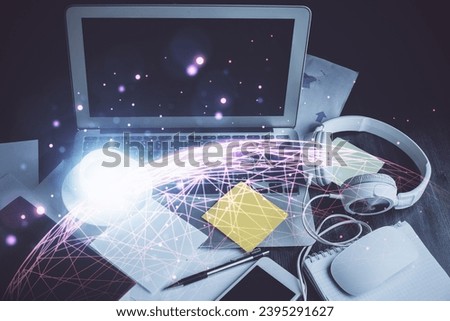 Computer on desktop with social network hologram. Double exposure. Concept of international people connections.