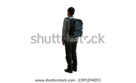 A young boy with a school backpack standing on a white background.