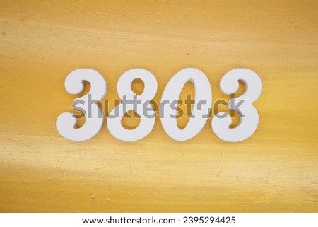 The golden yellow painted wood panel for the background, number 3803, is made from white painted wood.