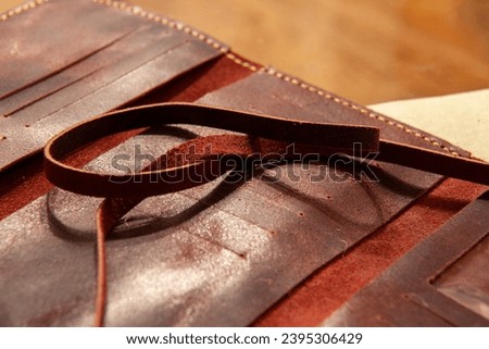 Brown and turquoise leather wallets