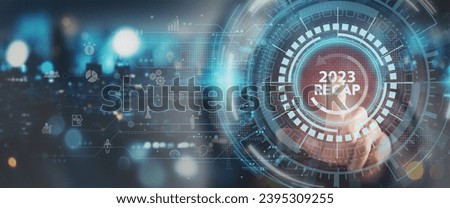 2023 Recap economy, business, financial concept. For business planning. Businessman touching on  word 2023 recap with smart screen background. Business transformation strategy and development. Royalty-Free Stock Photo #2395309255
