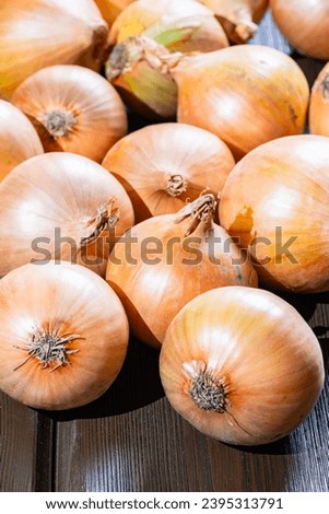 Fresh ripe onions on wooden table