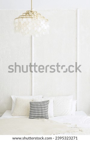 Contemporary apartment interior with modern furniture, soft pillows, and neutral colors, creating a comfortable and trendy ambiance. real photo.