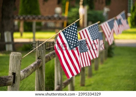 Rural America, American Flags on a Fence, Somewhere in Rural Ohio Royalty-Free Stock Photo #2395334329