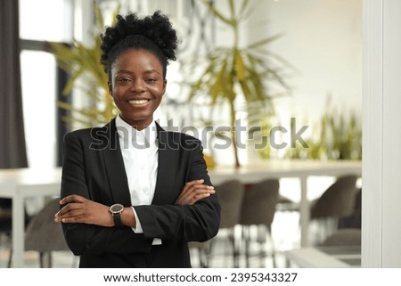 Happy woman with crossed arms in office, space for text. Lawyer, businesswoman, accountant or manager Royalty-Free Stock Photo #2395343327