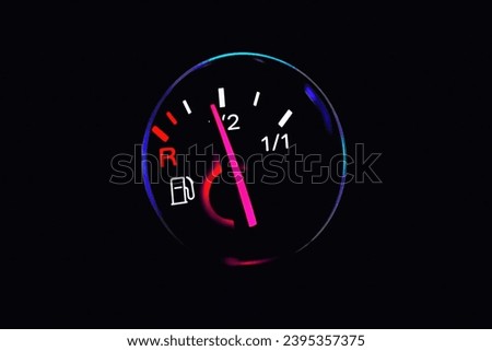 Motor temperature gauge of a car.Color detail with the coolant temperature gauge in a car.Car water temperature gauge at night.Toned.