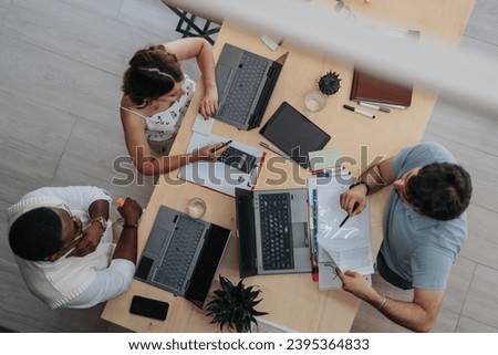 Achieve better efficiency and business growth with a diverse group of businesspeople working together in a modern office space. Royalty-Free Stock Photo #2395364833