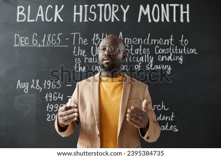 African American teacher talking about the history Royalty-Free Stock Photo #2395384735