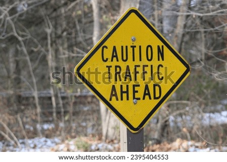 yellow caution traffic ahead street sign 