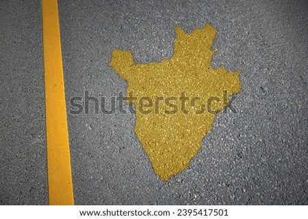 yellow map of burundi country on asphalt road near yellow line. concept