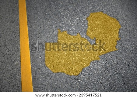 yellow map of zambia country on asphalt road near yellow line. concept