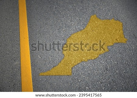 yellow map of morocco country on asphalt road near yellow line. concept