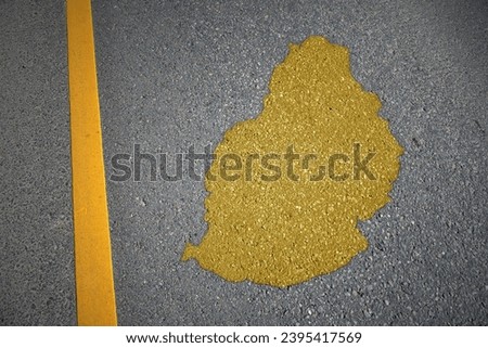 yellow map of mauritius country on asphalt road near yellow line. concept