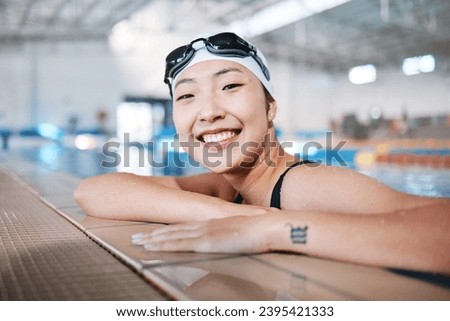 Professional swimming, portrait of happy woman in water at pool for exercise, wellness and winner mindset. Water sport, workout and champion asian swimmer at swim competition with smile and happiness