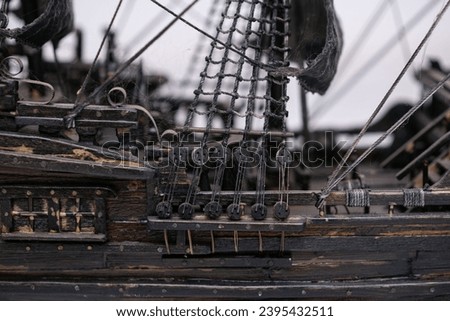 Handcrafted vintage sailing ship model interior with rich woodwork and intricate detailing.