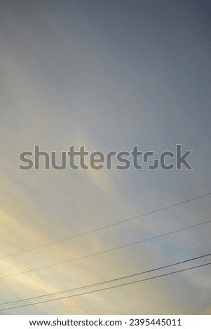 Delightful cloud sunset background portrait with high quality nature outdoors photography and powerlines. Perfect for hd wallpaper, beautiful relaxing aesthetic.