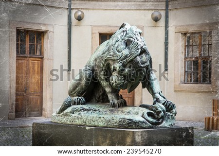 Dramatic lion statue in courtyard of the palace. Czech symbol.