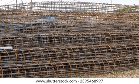 pile of Circular Reinforced Steel Columns for Reinforcing Wire for Pile Foundation Construction Photo Background.