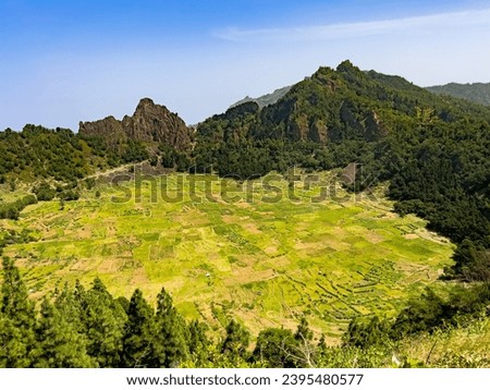 Volcanic calderra, covered with green fields and surrounded by mountains,  Santo Antán, Cape Verde