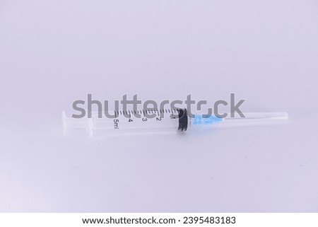 Syringe plastic empty 5ml with needle - product photography.