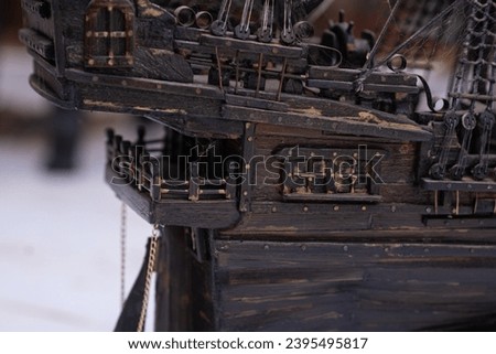 Interior of a handmade vintage sailing ship model. Rich woodwork and intricate details with exquisite details. A fascinating glimpse into the historic maritime world.