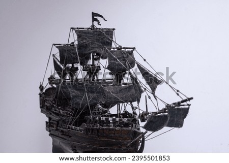 Handcrafted vintage sailing ship model. Rich woodwork, miniature cannons, navigational equipment and a thoughtfully designed layout. A fascinating glimpse of historic maritime artistry.