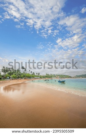 The beach at Unawatuna, Sri Lanka. Royalty-Free Stock Photo #2395505509