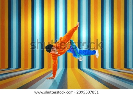 Stylishly dressed man performing freestyle, breakdance, standing on hands raised up legs against striped background. Swipe. Concept of action, art, beauty, sport, youth, creativity, lifestyle.