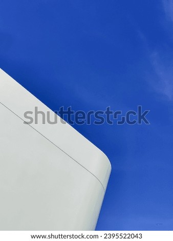 Abstract modern white architecture minimal style with a round corner against the blue sky.
