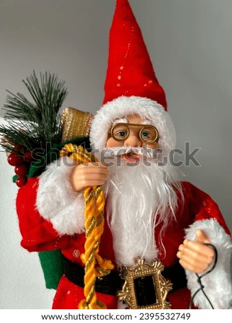 Santa Claus figurine on a gray background