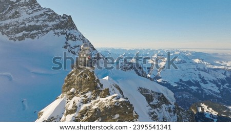 Panoramic landscape of Sphinx observatory and Aletsch glacier on Jungfraujoch Swiss Alps, Switzerland. Jungfrau top of europe in interlaken one of the highest mountain in the world on winter sunny day Royalty-Free Stock Photo #2395541341