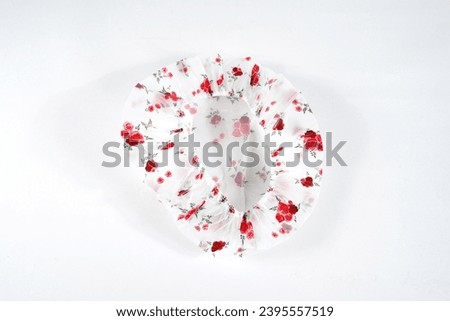 Shower cap floral motif isolated on white background Royalty-Free Stock Photo #2395557519