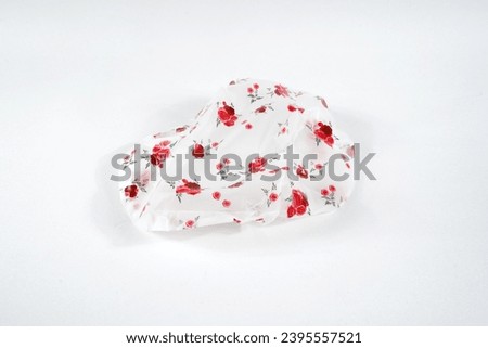 Shower cap floral motif isolated on white background Royalty-Free Stock Photo #2395557521