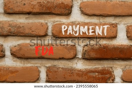 FDA Food and Drug Administration payment symbol. Concept words FDA payment on beautiful brown brick wall. Beautiful brown brick wall background. Business FDA payment concept. Copy space.