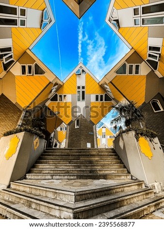 Yellow cubic houses and blue cloudy sky Royalty-Free Stock Photo #2395568877